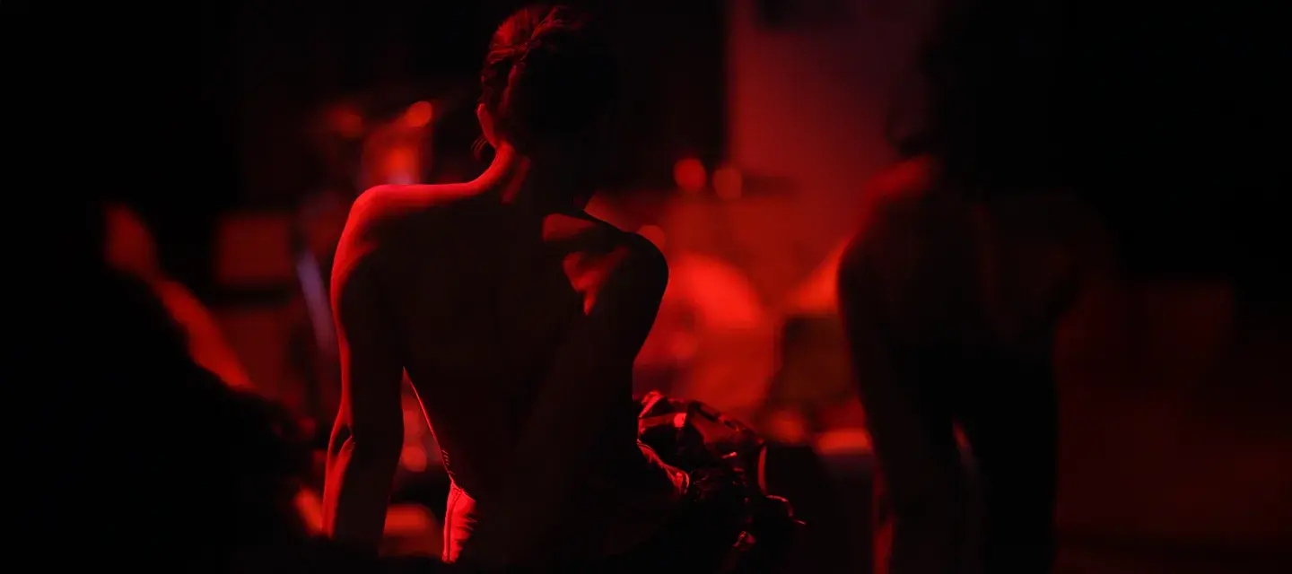 A woman in red light